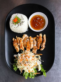 High angle view of salad with rice and meat in plate