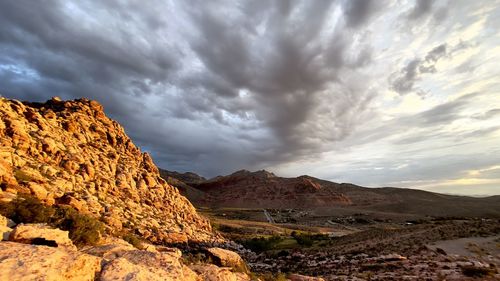 Scenic view of mountain against cloudy sky