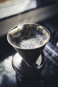 Close-up of coffee cup on table