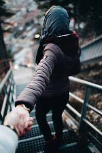 View of  couple walking down stairs