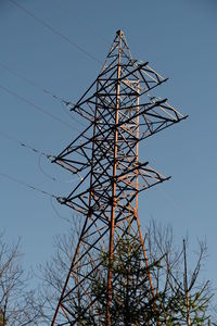 Low angle view of cables against clear blue sky