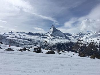 Scenic view of snowcapped mountains against sky