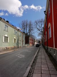 Street amidst buildings against sky
