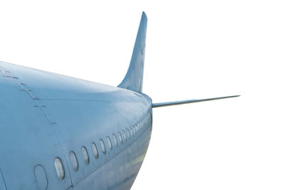 Close-up of airplane wing against clear sky