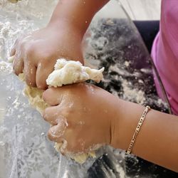Close-up of woman hand in water