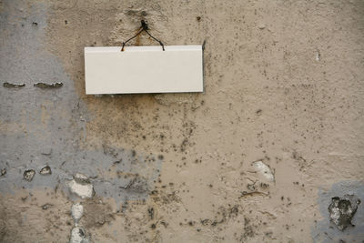 Blank nameplate on old weathered wall