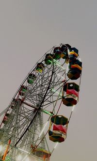 Low angle view of ferris wheel against sky