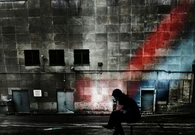 Full length of man standing in front of building