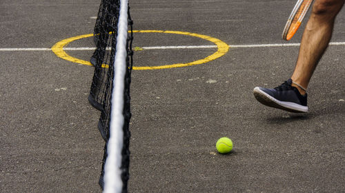 Low section of man playing tennis