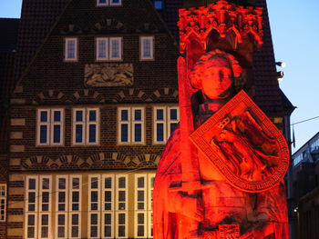 Low angle view of illuminated building in city