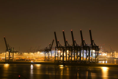 Pier at harbor against sky