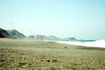 Scenic view of calm sea against clear sky