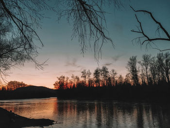 Scenic view of lake against sky during sunset