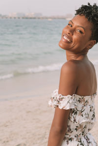 Portrait of a smiling young woman on beach