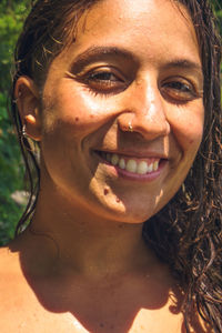 Close-up portrait of a smiling young woman