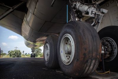 Close-up of vintage car on road