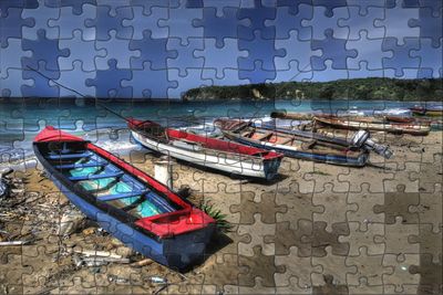 Boats moored in sea against sky