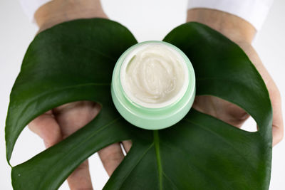 Close-up of hand holding drink