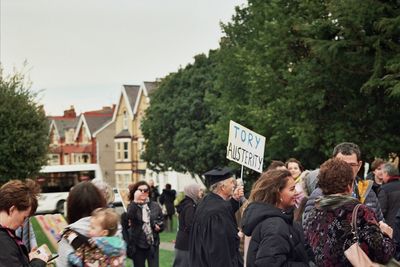 Group of people standing by plants