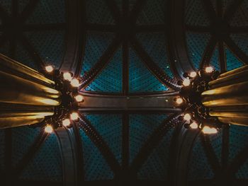 Low angle view of illuminated electric lamp