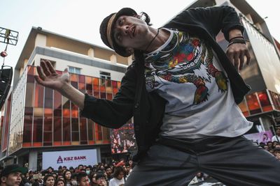 Full length of a man with arms raised