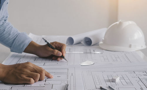 Low angle view of man working on table