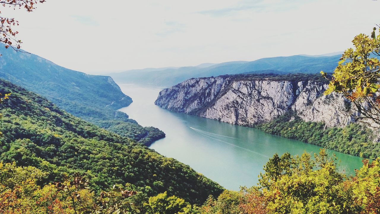 mountain, scenics, beauty in nature, nature, water, sky, sea, no people, tranquility, idyllic, tranquil scene, tree, outdoors, mountain range, day