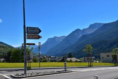 Road sign against clear sky