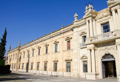Low angle view of building against blue sky