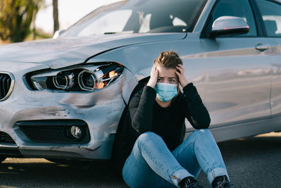 Full length of woman sitting in car