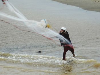 Full length of man standing on beach