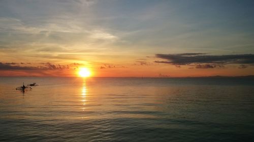 Scenic view of sea at sunset