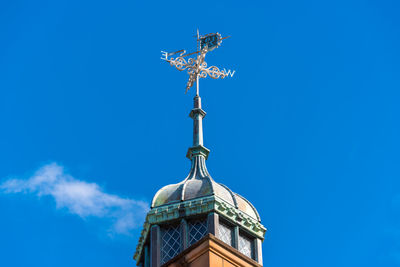 Low angle view of statue against blue sky