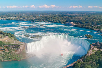 Aerial top landscape view of niagara falls between united states of america and canada. horseshoe 