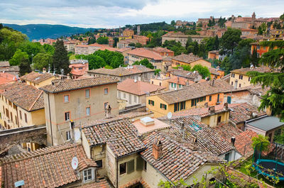 High angle view of townscape and trees against sky