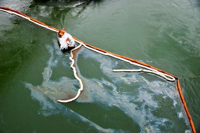 High angle view of men in boat on river