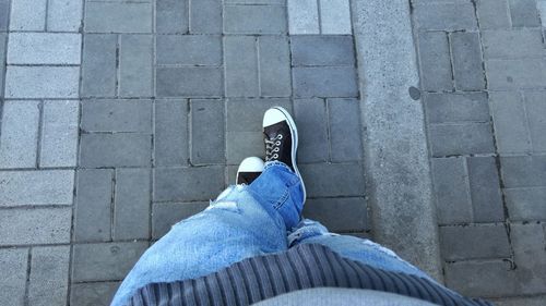 Low section of man standing on floor