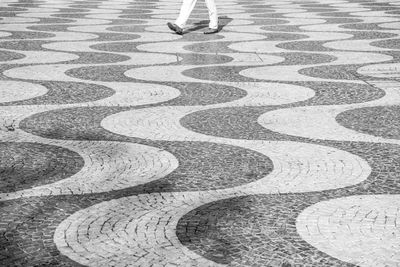 Low section of people walking on footpath