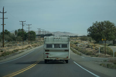 Cars on road against sky