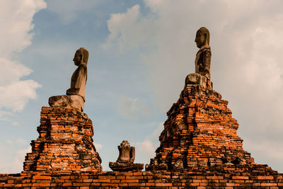 Low angle view of old building in ayutthaya province under the blue sky