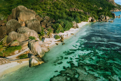 High angle view of rocks on sea shore