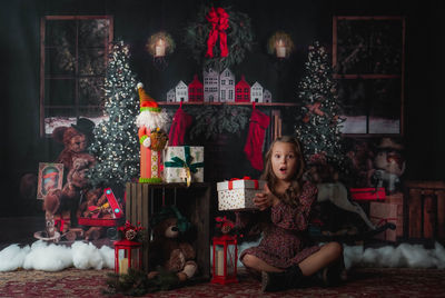 Rear view of mother and daughter at home