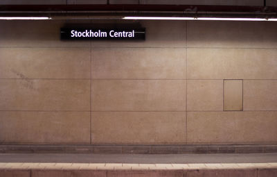 Information sign on wall at illuminated stockholm central station