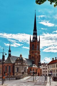 View of buildings in city against sky