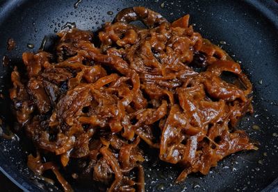 High angle view of meat in frying pan