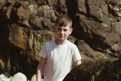 Portrait of boy standing outdoors