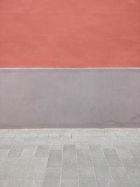 View of footpath against wall