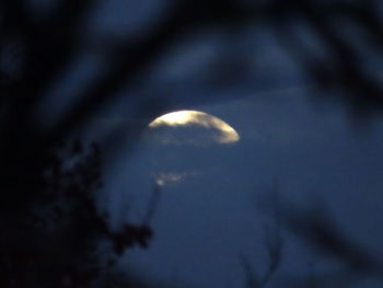 Low angle view of moon against sky at night