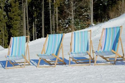 View of chairs on beach