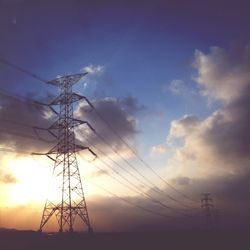 Low angle view of electricity pylon against sky